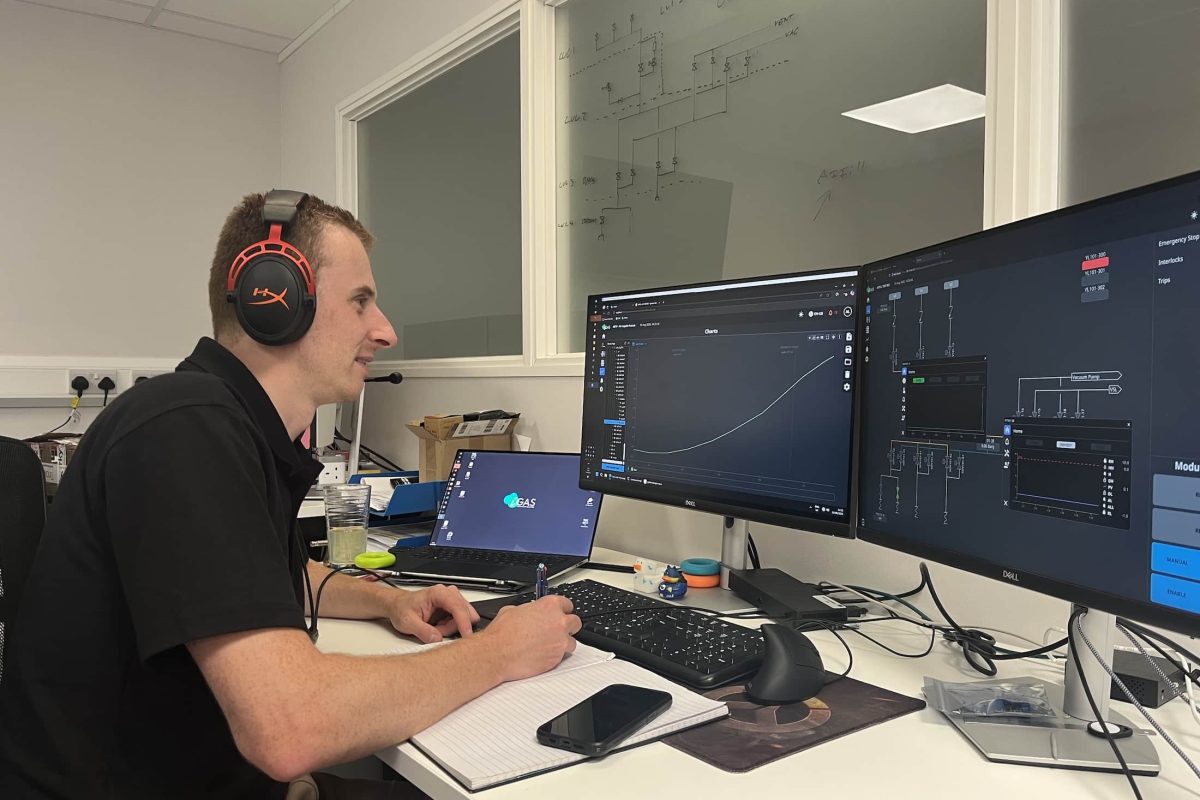 Engineer providing remote technical support using live system monitoring and control software